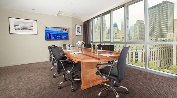 Photo 2 of Meeting Room with a view of NYC that can accommodate up to 8 people and including amenities, such as TV, coffee/tea/water and Wifi. 
